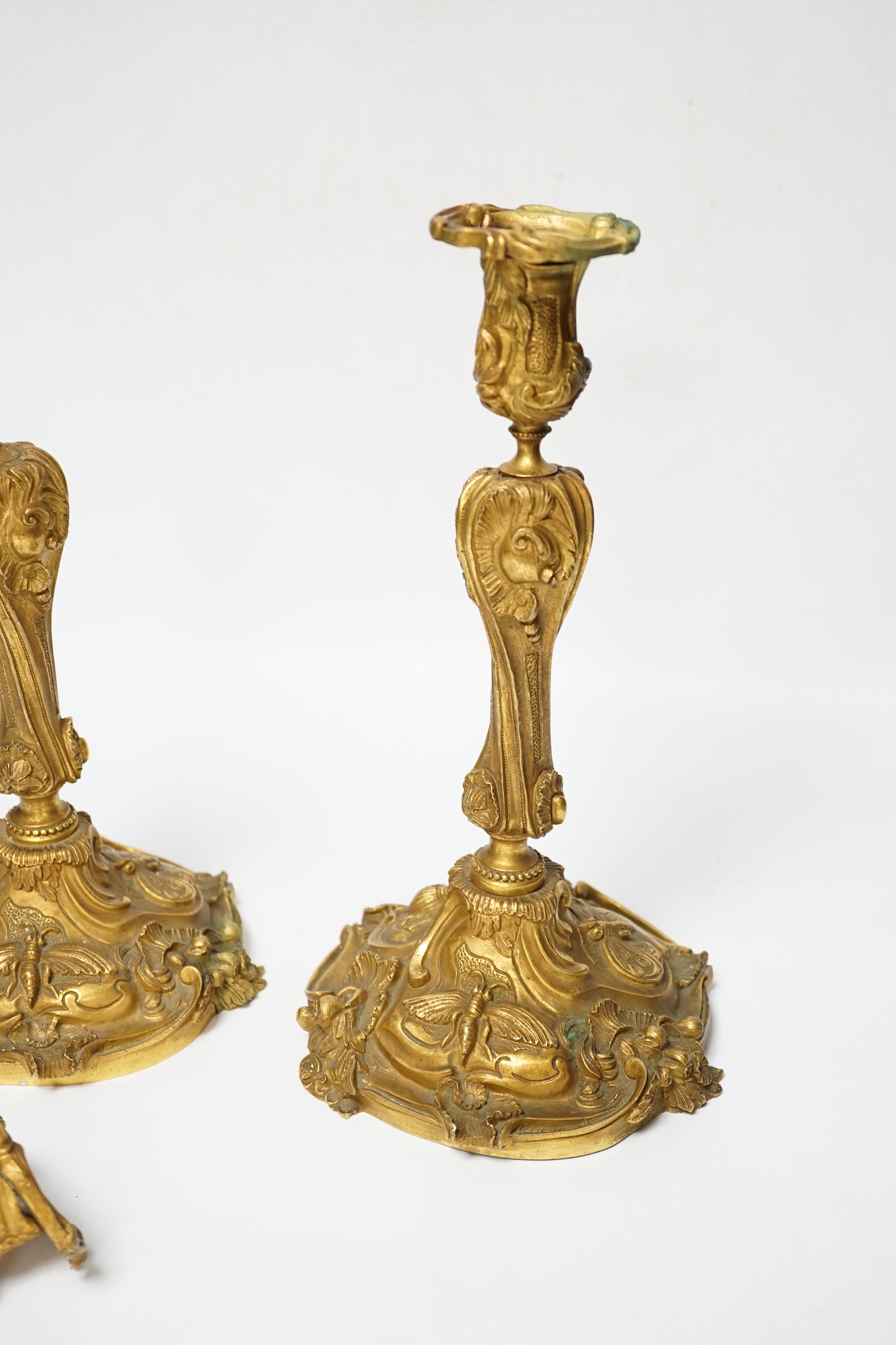 A pair of French ormolu candlesticks, one detached sconce, 30cm